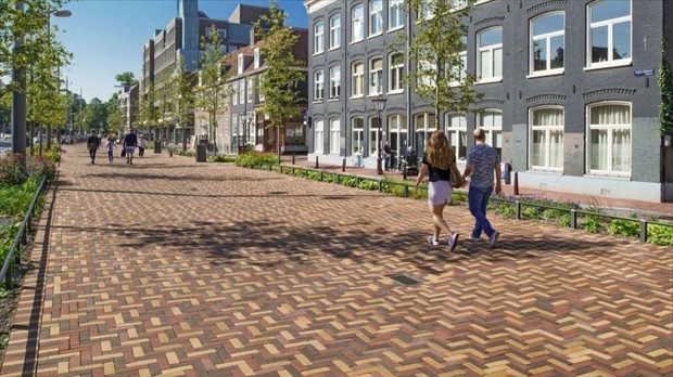 Herinrichting van de Vijzelgracht in Amsterdam met gecertificeerde straatbaksteen in historisch straatbeeld.